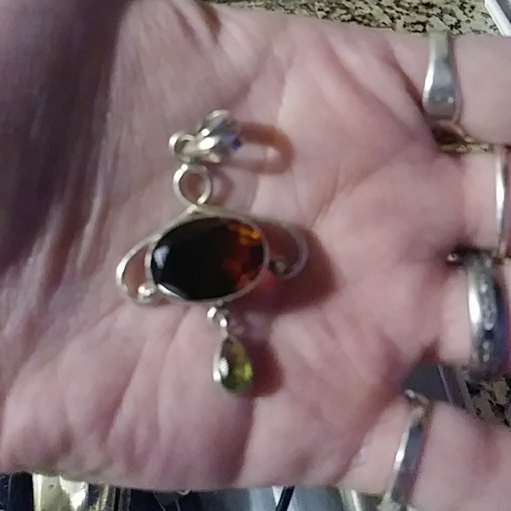 Sterling silver with red and green stones